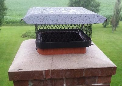 Raining chimney cap and chimney crown red brick chimney